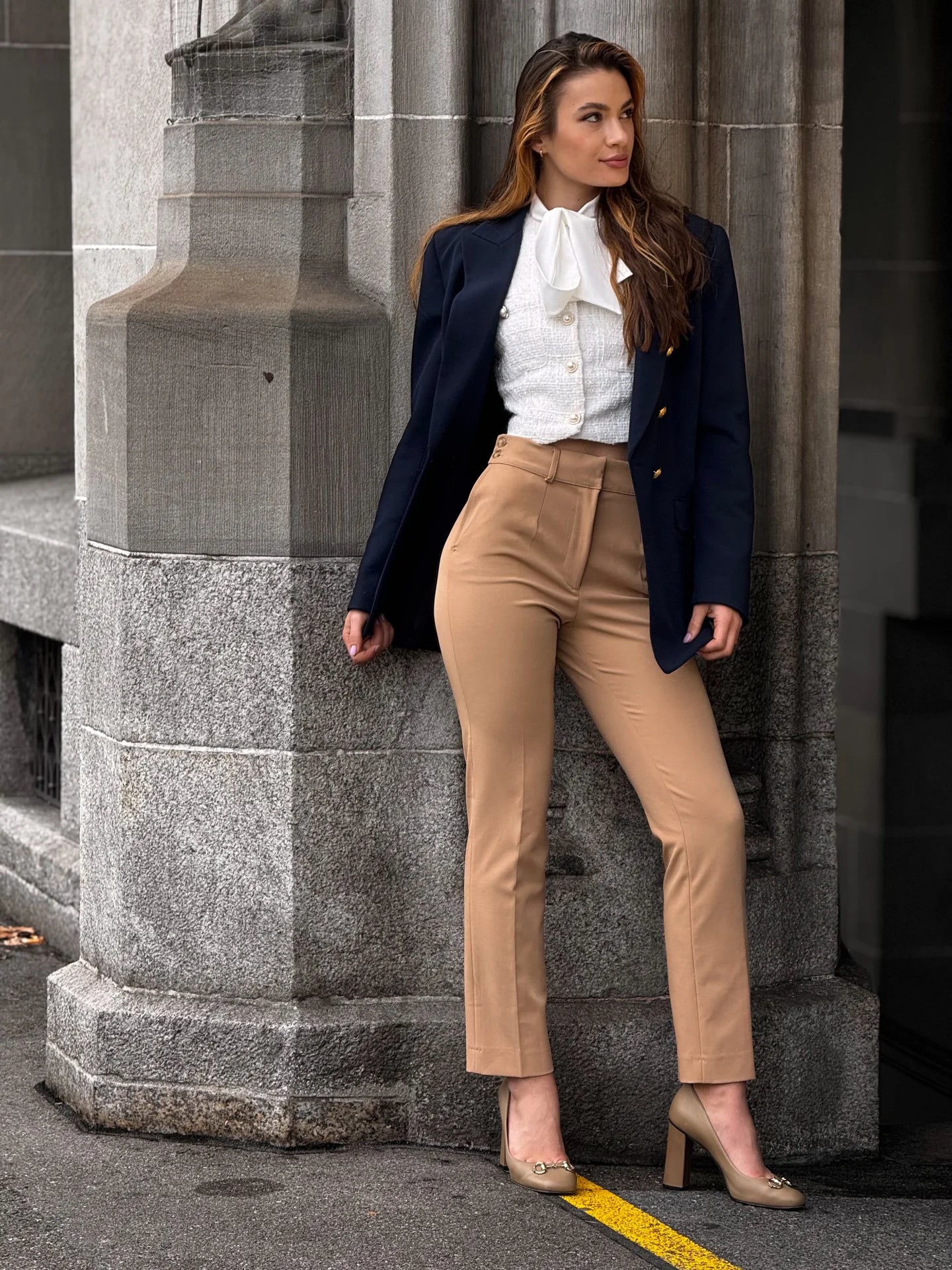 Seline wearing Beige Freydis pants with a navy blazer and white blouse, shown from head to toe.